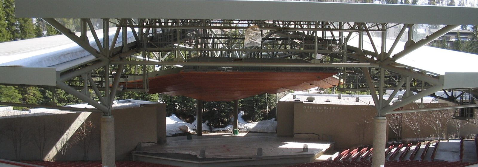 View of the Gerald R. Ford Amphitheater's covered stage and seating bowl in Vail, Colorado, with snow-covered mountainsides in the background - Gerald R. Ford Amphitheater tickets