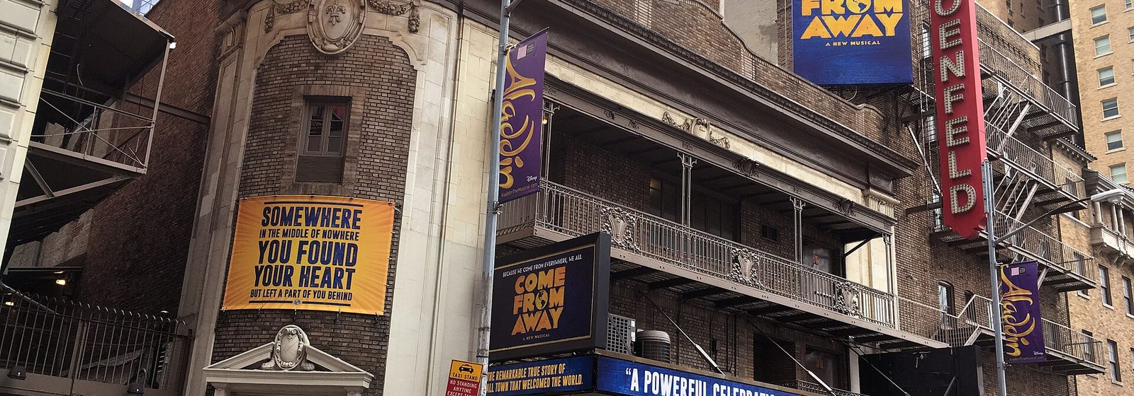 Street-level view of the Gerald Schoenfeld Theatre's corner facade and vertical Schoenfeld sign on West 45th Street in Manhattan, New York - Gerald Schoenfeld Theatre tickets