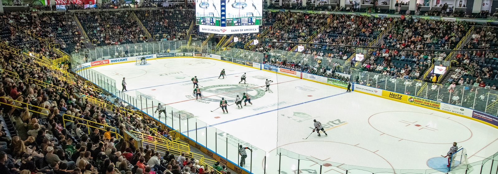Wide interior bowl view of Hertz Arena during a Florida Everblades hockey game in Estero, Florida, with the seating bowl and roof trusses filling the frame - Hertz Arena tickets