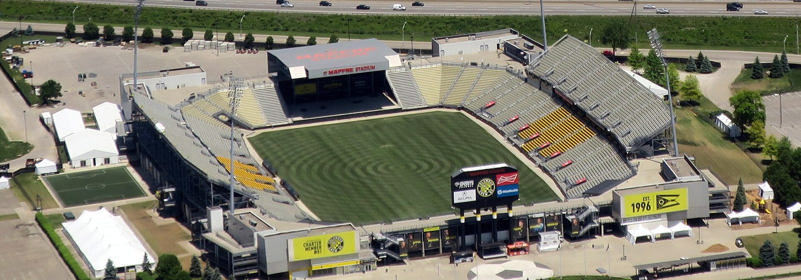 Aerial view of Historic Crew Stadium, then named Mapfre Stadium, with its open soccer bowl and grandstands beside Interstate 71 in Columbus, Ohio - Historic Crew Stadium tickets