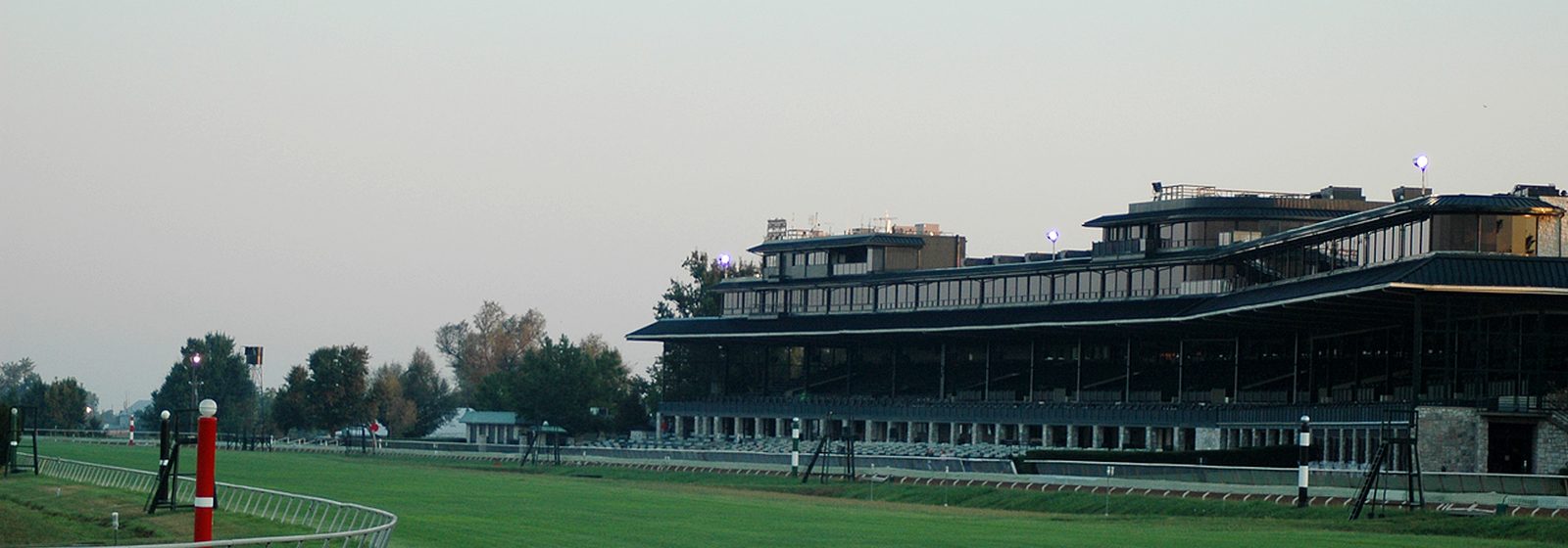 The multi-tiered grandstand of Keeneland Race Course seen across the turf track in the early morning in Lexington, Kentucky - Keeneland tickets