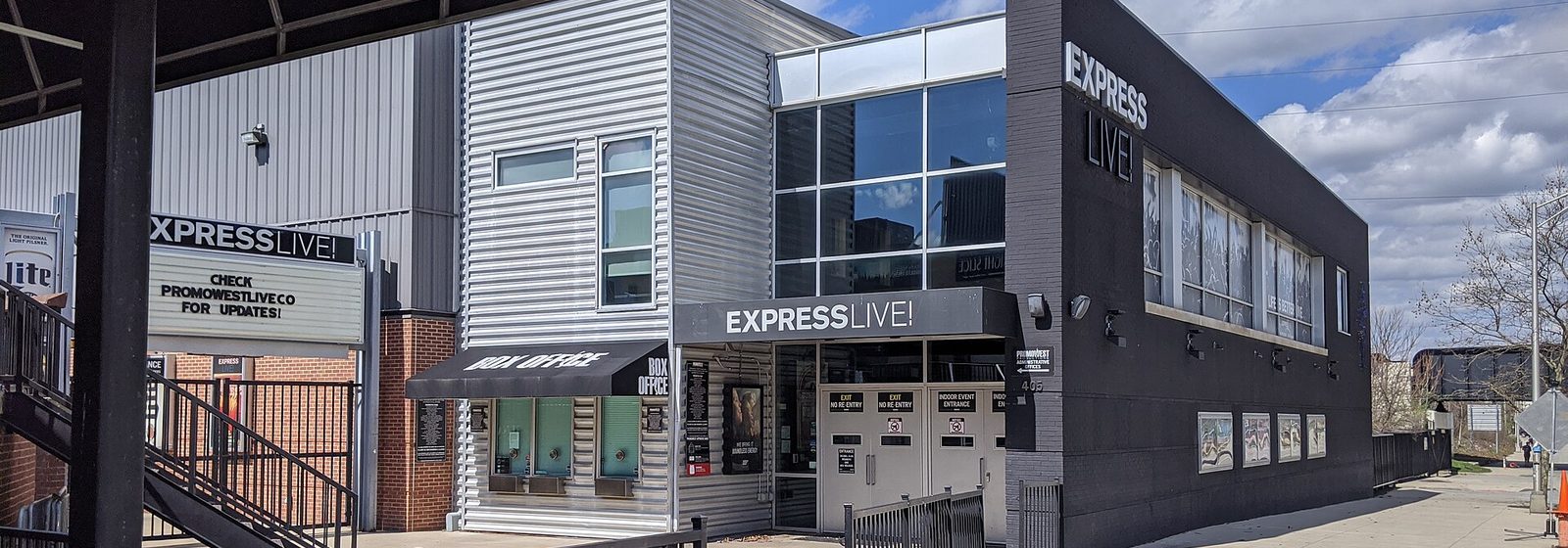 Street-level exterior view of the KEMBA Live! concert venue, then signed as Express Live!, showing its box office and metal-clad entrance in Columbus, Ohio - KEMBA Live! tickets