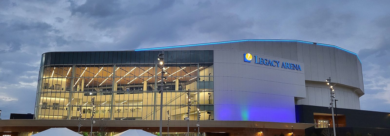 Evening exterior view of the renovated Legacy Arena at the BJCC in Birmingham, Alabama, with its glass facade and entrance plaza - Legacy Arena at The BJCC tickets