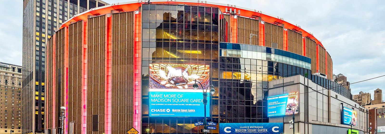 Street-level exterior view of Madison Square Garden's rounded facade above Pennsylvania Station at Eighth Avenue in Midtown Manhattan, New York - Madison Square Garden tickets
