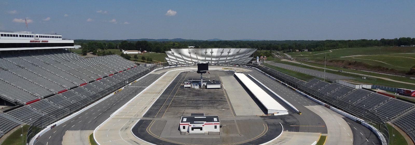 Elevated view of the half-mile oval track and grandstands at Martinsville Speedway in Ridgeway, Virginia - Martinsville Speedway tickets