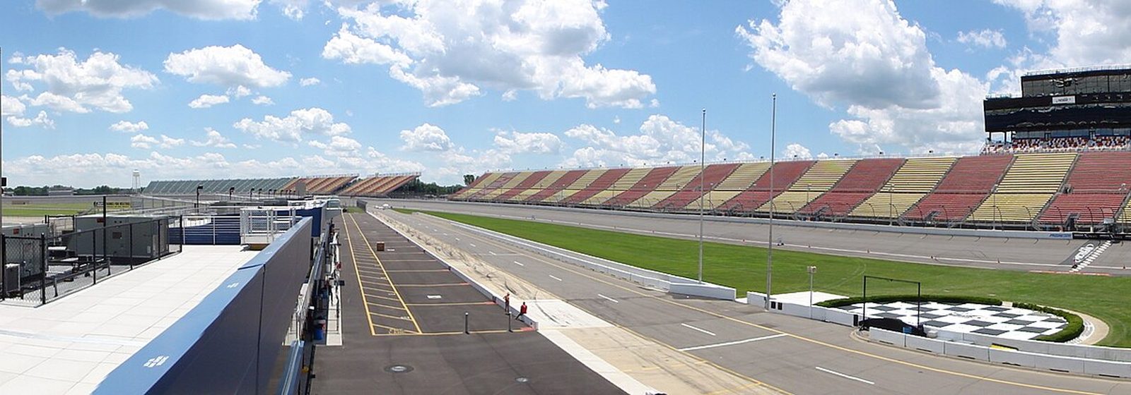 Panoramic view of the front-stretch grandstands and race track at Michigan International Speedway in Brooklyn, Michigan - Michigan International Speedway tickets