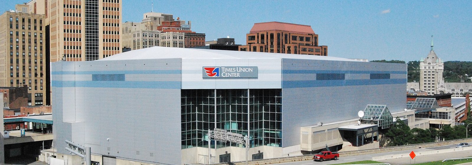 Exterior view of MVP Arena, then signed Times Union Center, with the downtown Albany, New York skyline rising behind it - MVP Arena tickets