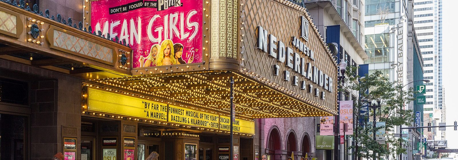 Street-level view of the James M. Nederlander Theatre facade and lighted marquee on Randolph Street in Chicago's Loop - Nederlander Theatre at Ford Center for the Performing Arts tickets