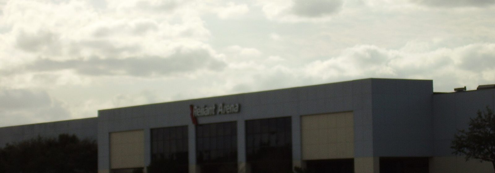 Exterior facade of NRG Arena in Houston, Texas, photographed across its parking lot when the building was signed as Reliant Arena - NRG Arena tickets