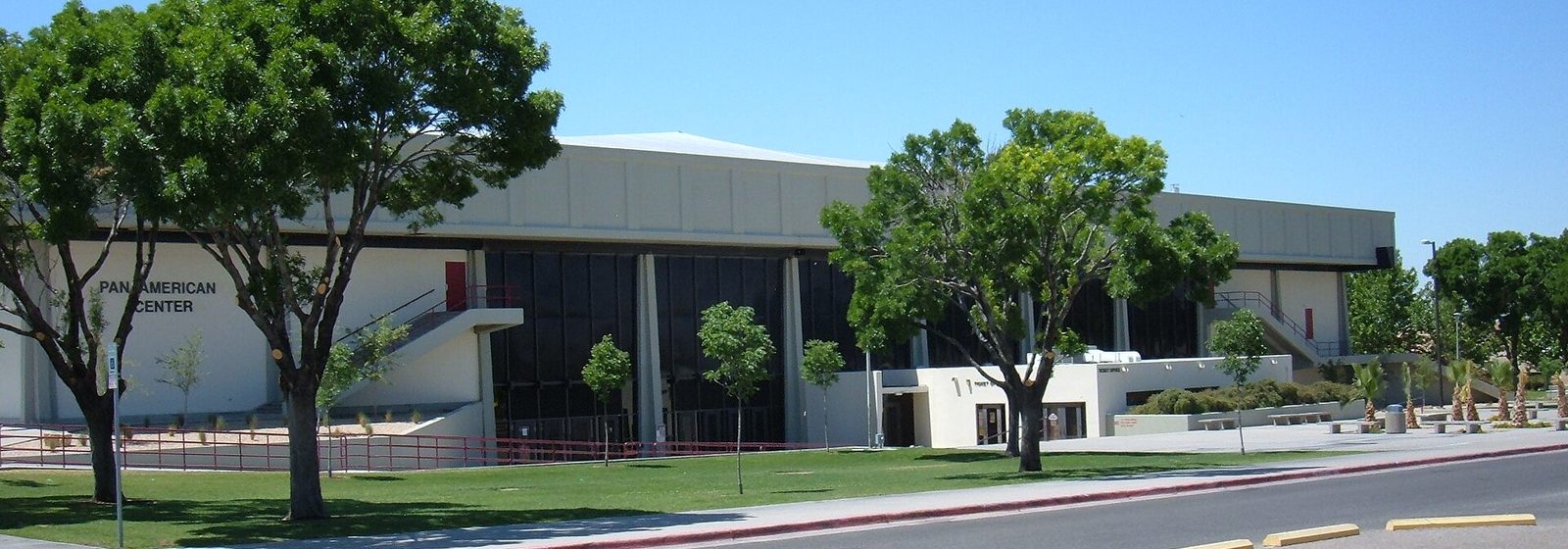 Exterior of the Pan American Center arena on the New Mexico State University campus in Las Cruces, with the venue name lettered on its wall - Pan American Center tickets