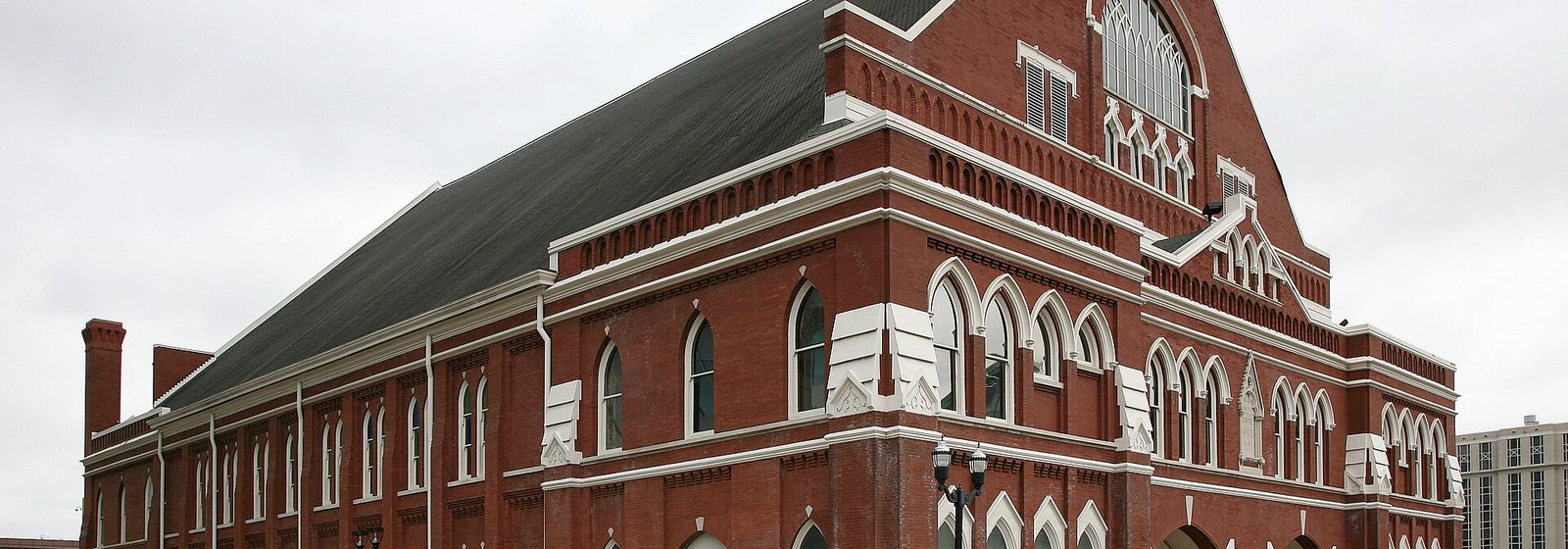Exterior view of the brick facade and arched windows of the Ryman Auditorium in downtown Nashville, Tennessee - Ryman Auditorium tickets