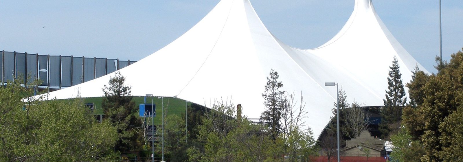 Exterior view of the twin white tent peaks of Shoreline Amphitheatre in Mountain View, California - Shoreline Amphitheatre - CA tickets