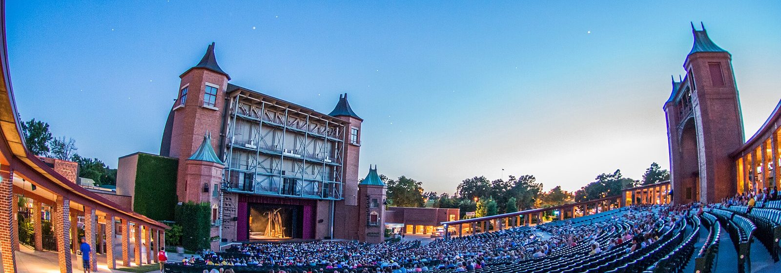 Evening view of the castle-like stage and open-air seating bowl at Starlight Theatre in Kansas City, Missouri - Starlight Theatre - Kansas City tickets