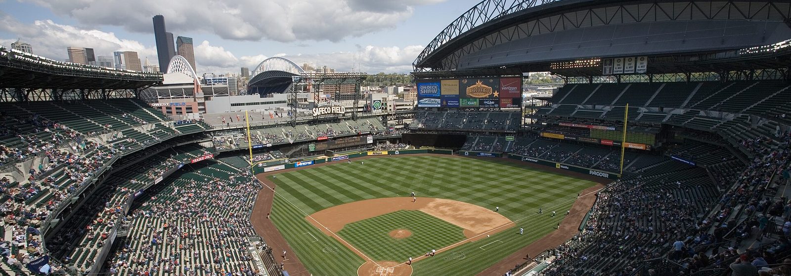 Interior view of the seating bowl at T-Mobile Park (then Safeco Field) in Seattle with the retractable roof open and the downtown skyline beyond the outfield - T-Mobile Park tickets
