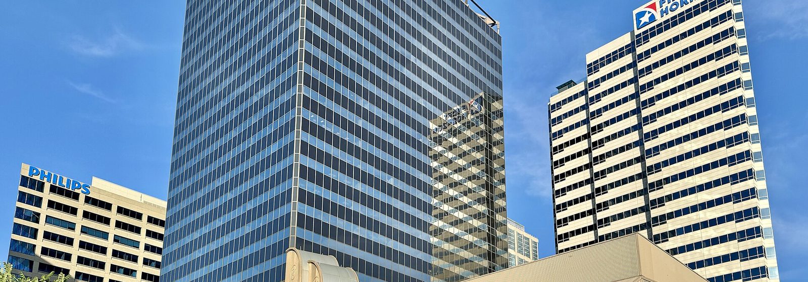 Street-level exterior view of the Tennessee Performing Arts Center, home of Andrew Jackson Hall, within the James K. Polk Building in downtown Nashville, Tennessee, showing the glass entrance and marquee below the office tower - Tennessee Performing Arts Center - Andrew Jackson Hall tickets