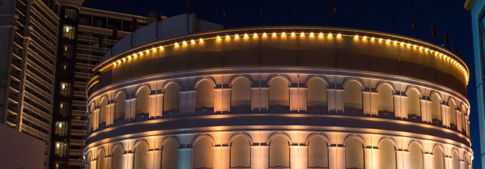 Evening exterior view of the round Colosseum theater building at Caesars Palace in Las Vegas, Nevada - The Colosseum At Caesars Palace tickets