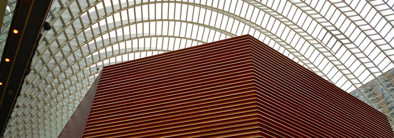 The wooden exterior of Verizon Hall beneath the glass-vaulted atrium of the Kimmel Center in Philadelphia - Verizon Hall at The Kimmel Center tickets