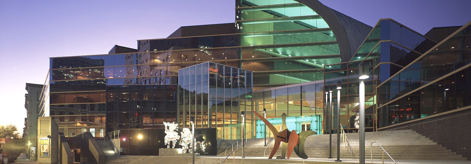 Evening exterior view of The Kentucky Center performing arts complex, home to Whitney Hall, in downtown Louisville, Kentucky - Whitney Hall at The Kentucky Center tickets